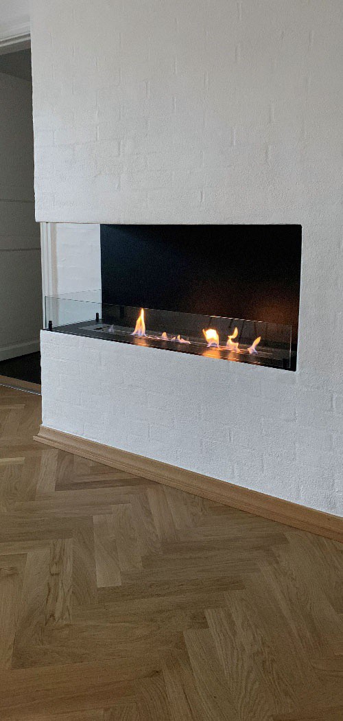 Foco Corner 1200 vestavěný krb v cihlové zdi
